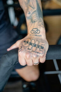 Level One by Lagree tattoo on Jurgen Lampl's hand.