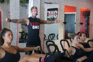 Jurgen Lampl leading a Lagree Method workout inside the Level One by Lagree studio
